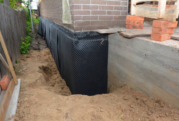 Happy homeowners after waterproofing job in Pemberton